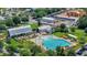 Aerial view of a community pool, cabana, and clubhouse surrounded by lush landscaping and convenient parking at 109 Medford St, Summerville, SC 29486