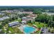An aerial view shows a community pool and clubhouse surrounded by lush landscaping and convenient parking at 109 Medford St, Summerville, SC 29486