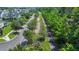 A neighborhood street view showcases tree-lined sidewalks, a playground, and manicured landscaping at 109 Medford St, Summerville, SC 29486