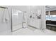 Bright bathroom featuring dual vanities, full-length mirror, and modern fixtures at 109 Medford St, Summerville, SC 29486