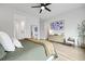 Spacious bedroom with light wood floors, a ceiling fan, and ample natural light at 109 Medford St, Summerville, SC 29486