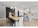 Open dining area with kitchen island and modern chandelier at 109 Medford St, Summerville, SC 29486