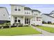 Charming two-story home featuring a welcoming front porch and manicured landscaping at 109 Medford St, Summerville, SC 29486
