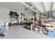 A well-lit two car garage featuring ample storage space, workout equipment, and an American flag at 109 Medford St, Summerville, SC 29486