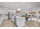 Spacious open-concept kitchen with quartz countertops, stainless steel appliances, and a large island at 109 Medford St, Summerville, SC 29486