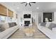 Inviting living room with fireplace, neutral decor, and plenty of natural light from large windows at 109 Medford St, Summerville, SC 29486
