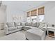 Cozy living room with a large sectional sofa, carpet, and windows with bamboo shades at 109 Medford St, Summerville, SC 29486