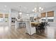 Bright, open-concept living and dining area with views into the white kitchen at 109 Medford St, Summerville, SC 29486