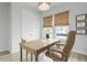Bright home office with woven shades, a wooden desk, and an executive chair at 109 Medford St, Summerville, SC 29486