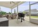 Outdoor patio featuring comfortable wicker seating, a grill, and a view of the backyard at 109 Medford St, Summerville, SC 29486