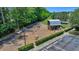 Aerial view of a neighborhood playground featuring slides, climbing structures, and a walking trail at 109 Medford St, Summerville, SC 29486