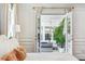 Bedroom showcasing a sunroom through double doors, with natural light at 1106 Meadowcroft Ln, Mount Pleasant, SC 29464