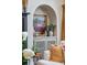 Charming living room built-in nook with storage and a decorative painting adds character to the home's interior at 1106 Meadowcroft Ln, Mount Pleasant, SC 29464