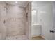Tiled bathroom with decorative accents, including new faucet and shower, with an adjacent powder room at 117 Dairy Ln, Cottageville, SC 29435
