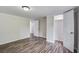 Bedroom featuring hardwood floors and two door openings into the hall and closet areas at 117 Dairy Ln, Cottageville, SC 29435