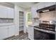 Well-equipped kitchen with stainless steel appliances, a stylish backsplash, and plenty of cabinet storage for organization at 117 Dairy Ln, Cottageville, SC 29435