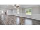 Spacious living room featuring luxury vinyl plank flooring, abundant natural light, and neutral tones for versatile decor at 117 Dairy Ln, Cottageville, SC 29435