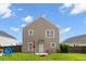 Exterior view of the home's backyard featuring a patio and green space at 1170 Deerberry Rd, Hanahan, SC 29410