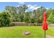 Backyard features a fire pit, green grass and a wooden fence at 1170 Deerberry Rd, Hanahan, SC 29410