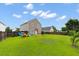 Exterior backyard view with a playground and grass at 1170 Deerberry Rd, Hanahan, SC 29410