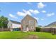 Backyard view of house, showcasing play area, grass and patio at 1170 Deerberry Rd, Hanahan, SC 29410