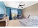 A bedroom featuring colorful walls, a ceiling fan, and a bed, creating a playful space at 1170 Deerberry Rd, Hanahan, SC 29410