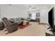 Comfortable living room with neutral tones, plush seating, and ample natural light, creating a welcoming and serene space at 1170 Deerberry Rd, Hanahan, SC 29410