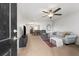 Inviting living room with modern decor, neutral tones, and open layout, featuring a ceiling fan and plush seating at 1170 Deerberry Rd, Hanahan, SC 29410