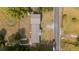 Top down aerial shot of a home featuring a yard, trees, and parked cars at 1211 Lem Rd, Cordesville, SC 29434