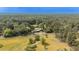 Expansive aerial view of a home surrounded by lush greenery and trees in a serene and peaceful setting at 1211 Lem Rd, Cordesville, SC 29434