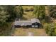 Bird's eye view showcases a property featuring mature trees and a fenced back yard at 1211 Lem Rd, Cordesville, SC 29434