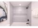 Clean bathroom with grey tiled shower/tub combo with a built-in shelf and gold accents at 1211 Lem Rd, Cordesville, SC 29434