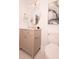 Cozy bathroom features a unique mirror, grey vanity with gold accents, and modern toilet at 1211 Lem Rd, Cordesville, SC 29434