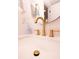 Close up of modern brass faucet and white counter in a stylish bathroom at 1211 Lem Rd, Cordesville, SC 29434