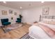Stylish bedroom featuring hardwood floors, artful decor, and comfortable seating area at 1211 Lem Rd, Cordesville, SC 29434