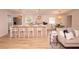 Bright living room with a modern fireplace and open plan with the kitchen and barstool seating for a spacious layout at 1211 Lem Rd, Cordesville, SC 29434