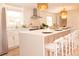 Bright and stylish kitchen with white countertops, stainless steel appliances, and pendant lighting over the bar seating at 1211 Lem Rd, Cordesville, SC 29434