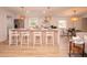 Bright living room with a modern fireplace and open plan with the kitchen and barstool seating for a spacious layout at 1211 Lem Rd, Cordesville, SC 29434