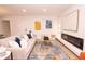 Cozy living room with a fireplace, comfortable sofa, stylish rug, and contemporary art decor, for relaxation at 1211 Lem Rd, Cordesville, SC 29434