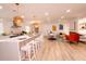 Bright living room with a modern fireplace and open plan with the kitchen and barstool seating for a spacious layout at 1211 Lem Rd, Cordesville, SC 29434