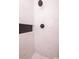 Bright shower features white marble tiles, a modern shower head and a built-in shelf at 1211 Lem Rd, Cordesville, SC 29434