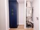 Utility room showcasing an HVAC system, white walls, and blue storage cabinets for organization at 1211 Lem Rd, Cordesville, SC 29434