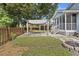 Charming backyard space with fire pit, patio, mature trees, and a covered pergola at 1245 Lakefront Drive Dr, Charleston, SC 29412