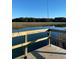 Scenic fishing pier with two fishing poles ready for a day of catching fish at 1245 Lakefront Drive Dr, Charleston, SC 29412