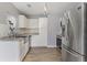 Modern kitchen with stainless steel appliances, white cabinets, and granite countertops at 1245 Lakefront Drive Dr, Charleston, SC 29412