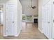 Inviting hallway view into living room featuring fireplace, wood-look flooring and an open layout at 1245 Lakefront Drive Dr, Charleston, SC 29412