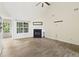 Living room featuring fireplace, ceiling fan, wood-look tile floors, and ample natural light at 1245 Lakefront Drive Dr, Charleston, SC 29412