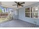 Comfortable screened-in porch with wood flooring and backyard views, great for relaxing or entertaining at 1245 Lakefront Drive Dr, Charleston, SC 29412