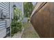 Side yard of the home showing utilities and the proximity of the fence line at 1245 Lakefront Drive Dr, Charleston, SC 29412