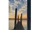 Dock extending over the water towards a stunning sunset view at 1245 Lakefront Drive Dr, Charleston, SC 29412